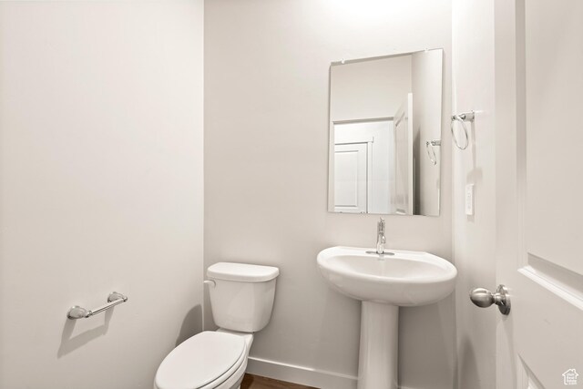 1264 N Berra Blvd Unit 133, Tooele, UT 84074 - half bathroom featuring baseboards and toilet