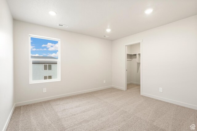 1264 N Berra Blvd Unit 133, Tooele, UT 84074 - unfurnished bedroom featuring baseboards, carpet, recessed lighting, and visible vents