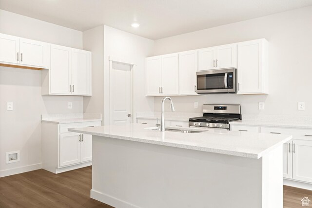 1264 N Berra Blvd Unit 133, Tooele, UT 84074 - kitchen featuring a sink, appliances with stainless steel finishes, white cabinets, and dark wood-style floors