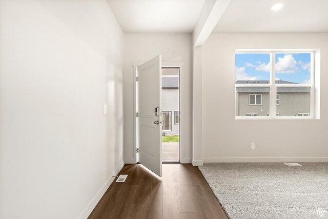 1264 N Berra Blvd Unit 133, Tooele, UT 84074 - doorway to outside with baseboards, visible vents, and dark wood-type flooring