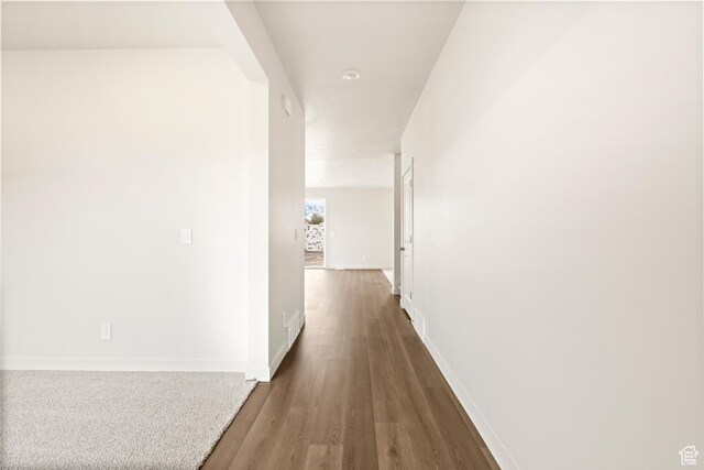 1264 N Berra Blvd Unit 133, Tooele, UT 84074 - hallway featuring baseboards and wood finished floors