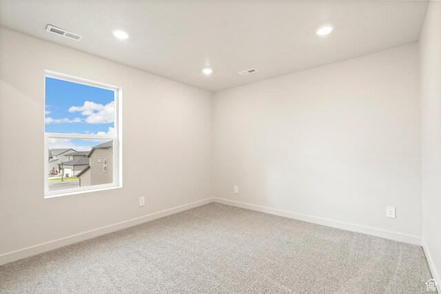 1264 N Berra Blvd Unit 133, Tooele, UT 84074 - spare room with carpet flooring, baseboards, and visible vents