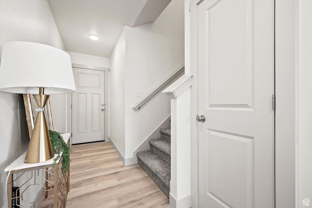 658 S 85 E Unit 13, Smithfield, UT 84335 - entrance foyer featuring light wood finished floors, stairway, and baseboards
