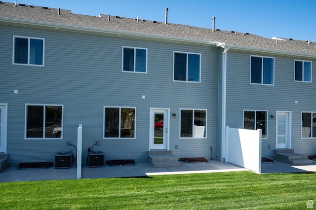658 S 85 E Unit 13, Smithfield, UT 84335 - back of property featuring entry steps, a patio, central AC unit, and a lawn