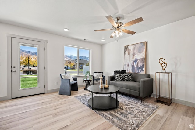 658 S 85 E Unit 13, Smithfield, UT 84335 - living area featuring healthy amount of natural light, light wood-style flooring, a mountain view, and a ceiling fan