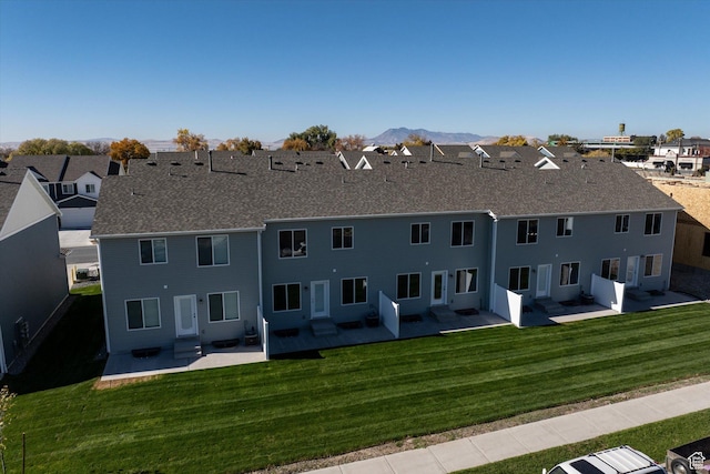 658 S 85 E Unit 13, Smithfield, UT 84335 - back of property with a patio, a yard, a residential view, and entry steps