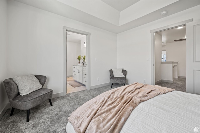 658 S 85 E Unit 13, Smithfield, UT 84335 - bedroom with light colored carpet, baseboards, and connected bathroom