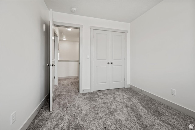 658 S 85 E Unit 13, Smithfield, UT 84335 - unfurnished bedroom with carpet, baseboards, and a closet