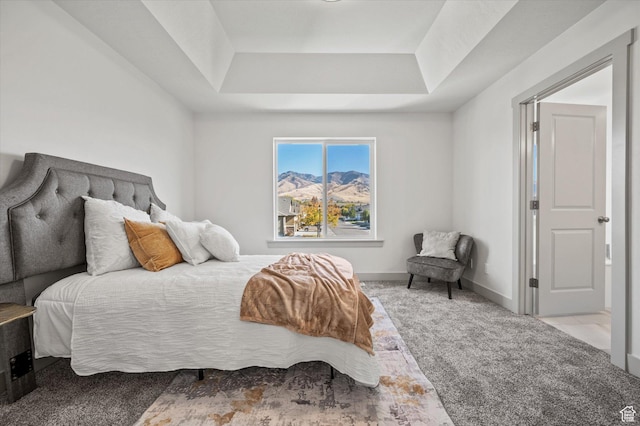 658 S 85 E Unit 13, Smithfield, UT 84335 - carpeted bedroom featuring a raised ceiling, a mountain view, and baseboards