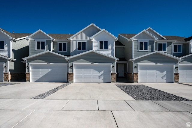 658 S 85 E Unit 13, Smithfield, UT 84335 - multi unit property featuring stone siding, concrete driveway, and board and batten siding