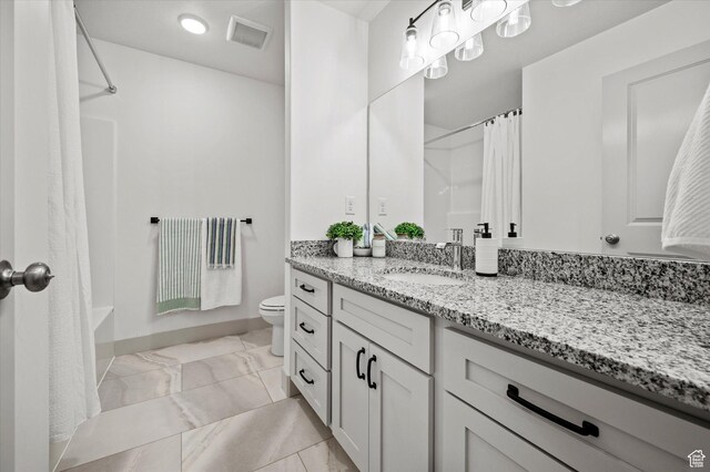 658 S 85 E Unit 13, Smithfield, UT 84335 - bathroom featuring toilet, vanity, and baseboards