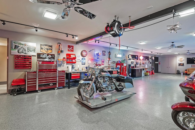 garage with ceiling fan and a workshop area