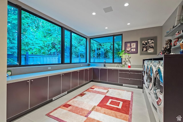 laundry room featuring laundry area, recessed lighting, and washing machine and clothes dryer