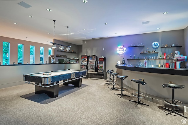 recreation room featuring recessed lighting, baseboards, carpet flooring, and a dry bar