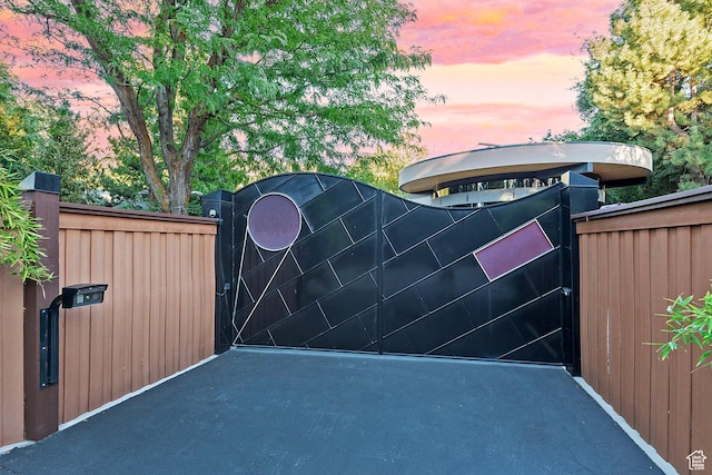 view of gate at dusk