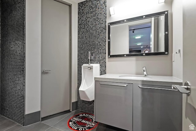 bathroom with tile patterned flooring and vanity