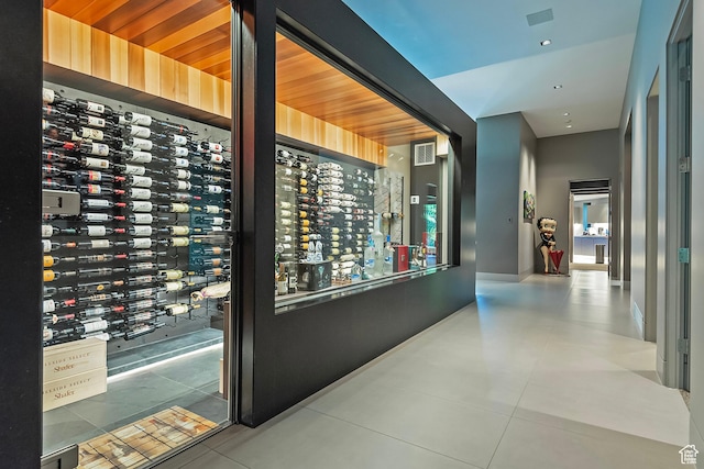 wine area with visible vents and tile patterned floors