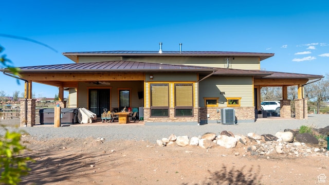630 W 150 S, Torrey, UT 84775 - back of property with a standing seam roof, a patio area, central AC, and stone siding