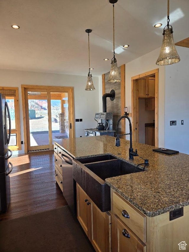 630 W 150 S, Torrey, UT 84775 - kitchen featuring a wood stove, a sink, freestanding refrigerator, dishwasher, and recessed lighting