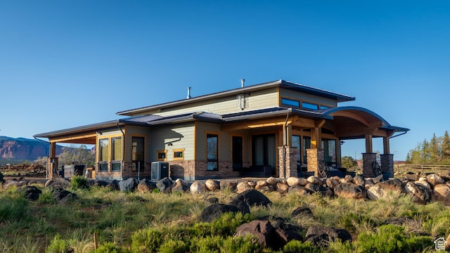 630 W 150 S, Torrey, UT 84775 - rear view of house with cooling unit, a mountain view, and stone siding