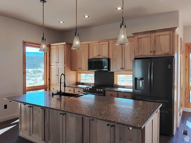 630 W 150 S, Torrey, UT 84775 - kitchen with black refrigerator with ice dispenser, a sink, gas range, a kitchen island with sink, and plenty of natural light