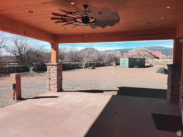 630 W 150 S, Torrey, UT 84775 - view of patio with a mountain view, ceiling fan, and fence