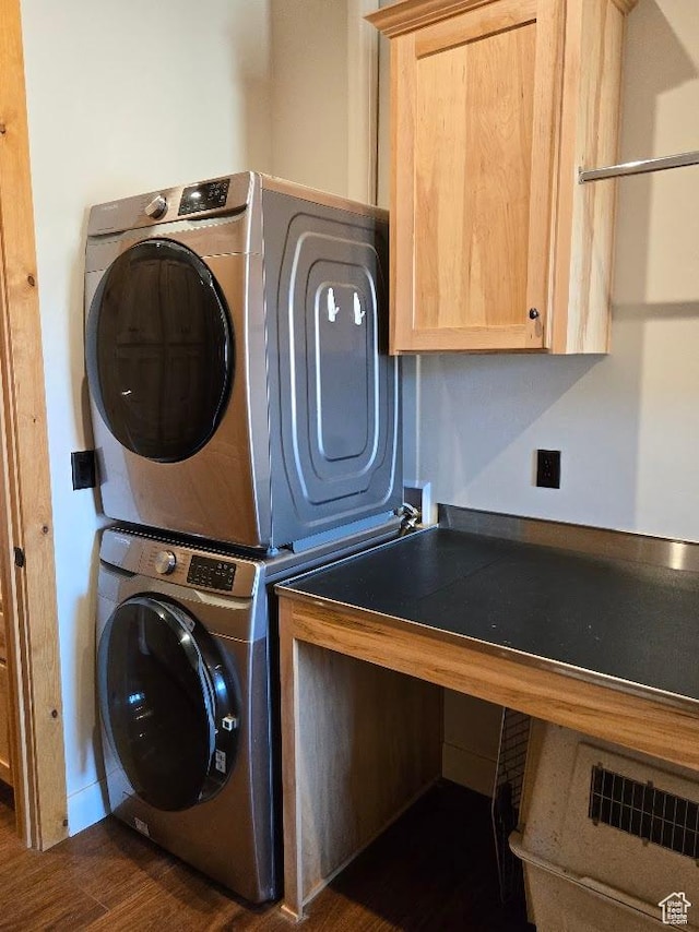 630 W 150 S, Torrey, UT 84775 - laundry room featuring stacked washer and clothes dryer, cabinet space, and dark wood finished floors