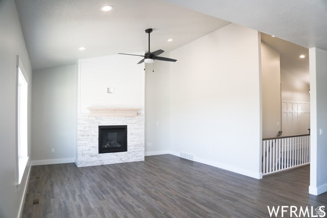 unfurnished living room featuring recessed lighting, a fireplace, ceiling fan, dark wood-style flooring, and baseboards