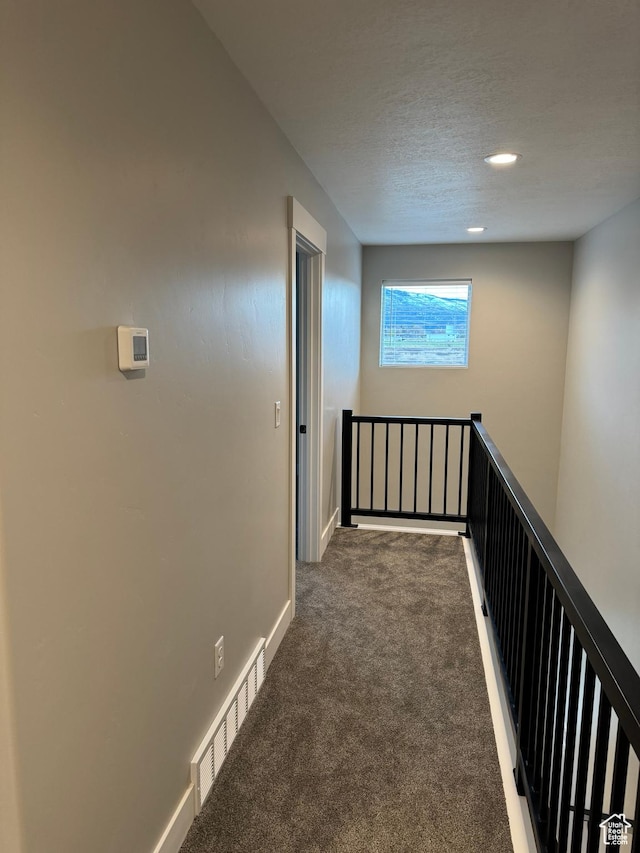 165 E 700 N Unit 13, Ephraim, UT 84627 - hall featuring an upstairs landing, visible vents, carpet flooring, and baseboards