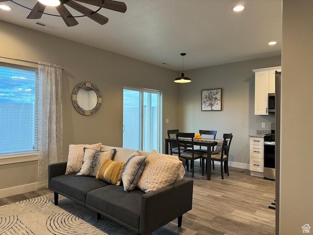 165 E 700 N Unit 13, Ephraim, UT 84627 - living room with visible vents, recessed lighting, light wood finished floors, baseboards, and ceiling fan