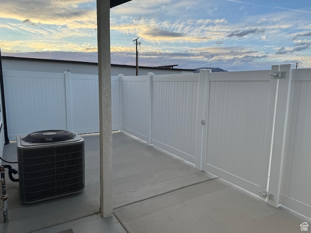169 E 700 N Unit 14, Ephraim, UT 84627 - patio terrace at dusk featuring cooling unit and fence