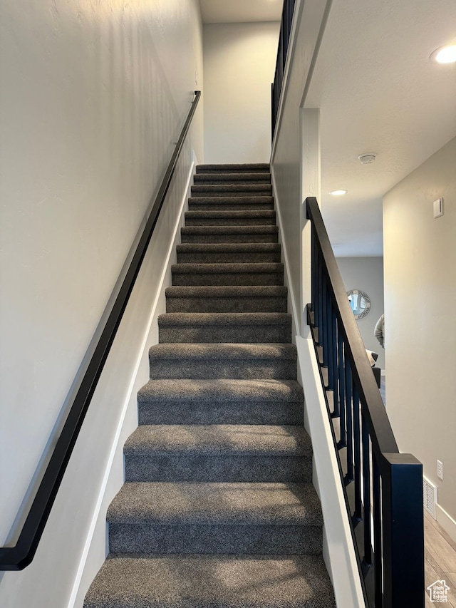 169 E 700 N Unit 14, Ephraim, UT 84627 - stairs featuring wood finished floors, recessed lighting, and baseboards