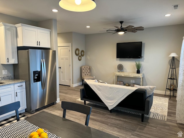 169 E 700 N Unit 14, Ephraim, UT 84627 - kitchen featuring visible vents, white cabinets, wood finished floors, stainless steel fridge, and a ceiling fan
