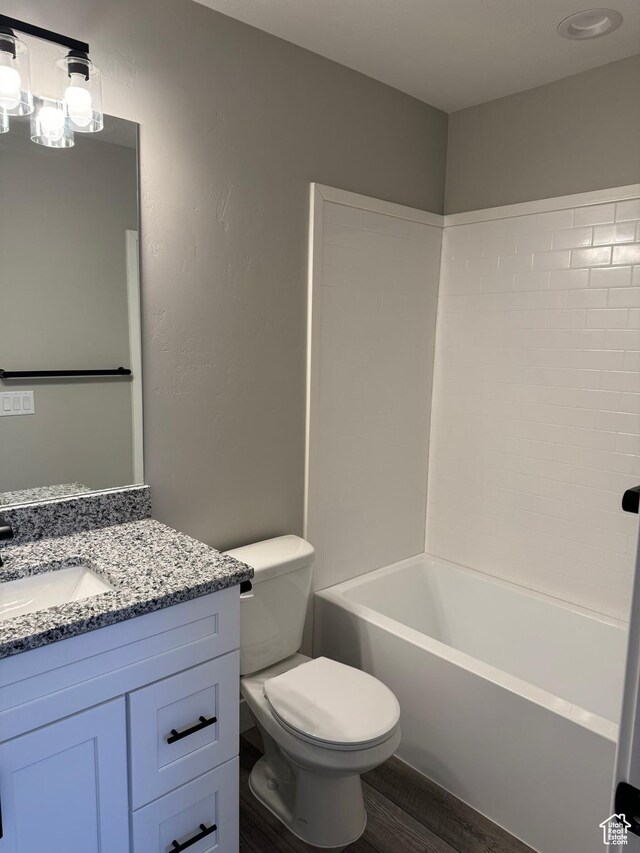 169 E 700 N Unit 14, Ephraim, UT 84627 - bathroom featuring vanity,  shower combination, toilet, and wood finished floors