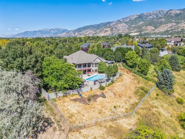 birds eye view of property with a mountain view
