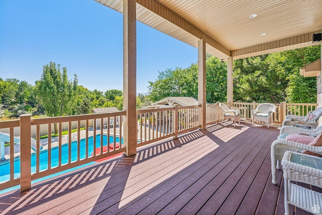 wooden terrace featuring an outdoor pool