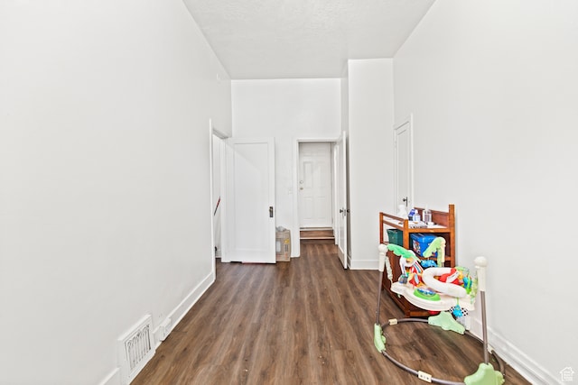 69 S Main St, Manti, UT 84642 - recreation room with dark wood-type flooring and a textured ceiling