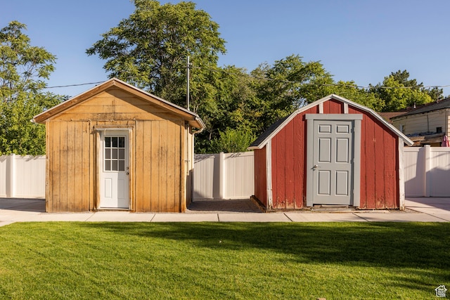 view of outbuilding featuring a yard