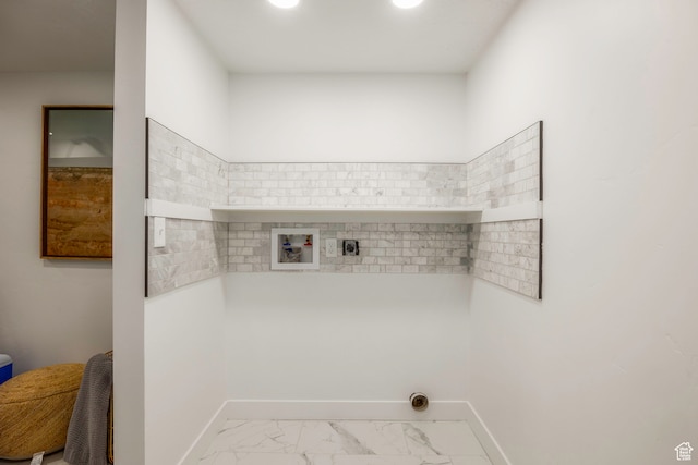 washroom featuring washer hookup, light tile patterned flooring, and hookup for an electric dryer