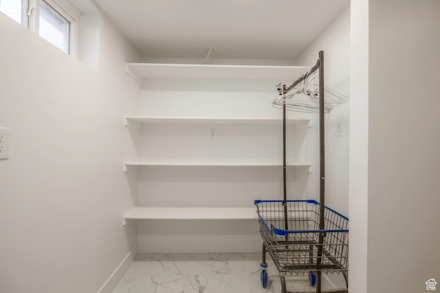 spacious closet featuring tile patterned flooring