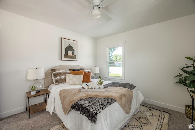 bedroom featuring light colored carpet and ceiling fan