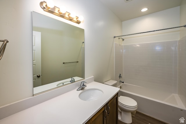 3385 S Marblewood Dr, St George, UT 84790 - full bathroom with tiled shower / bath combo, vanity, toilet, and hardwood / wood-style floors