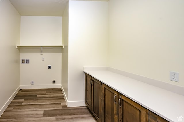 3385 S Marblewood Dr, St George, UT 84790 - laundry area with hookup for a washing machine, wood-type flooring, hookup for an electric dryer, and cabinets