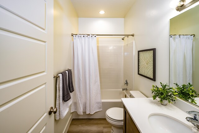 3385 S Marblewood Dr, St George, UT 84790 - full bathroom featuring vanity, toilet, hardwood / wood-style flooring, and shower / bath combo