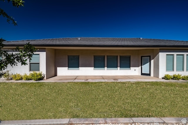 3385 S Marblewood Dr, St George, UT 84790 - back of property with a lawn and a patio area