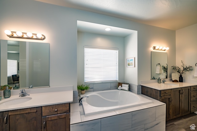 3385 S Marblewood Dr, St George, UT 84790 - bathroom featuring vanity and a relaxing tiled tub