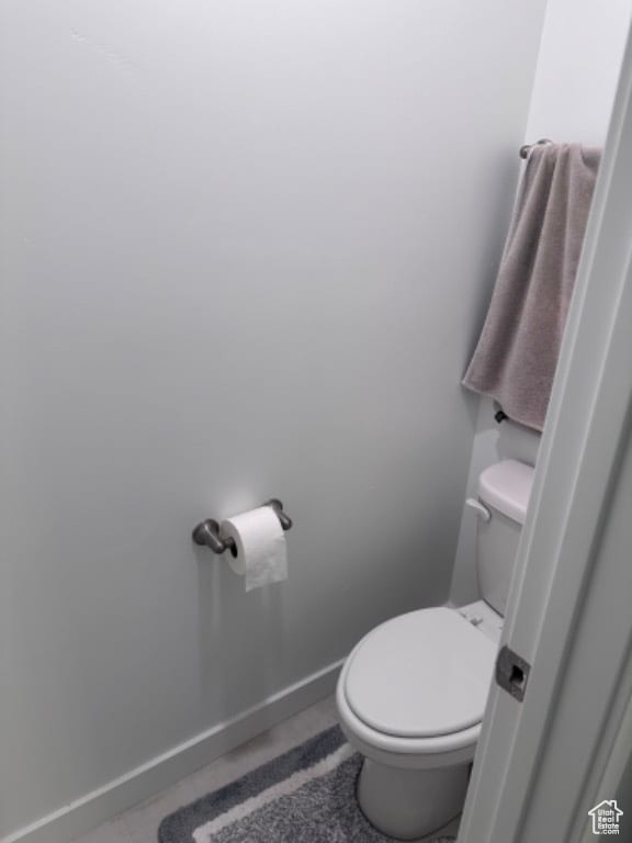 bathroom featuring tile patterned flooring and toilet