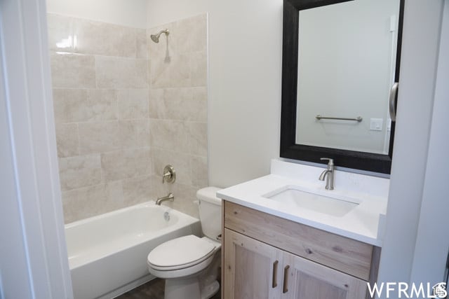 3175 W 3100 S Unit 11, West Haven, UT 84401 - full bathroom featuring tiled shower / bath, vanity, and toilet