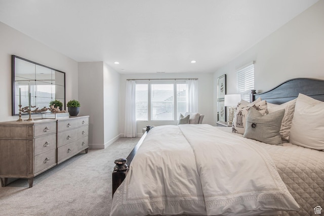 bedroom with recessed lighting, baseboards, and light carpet