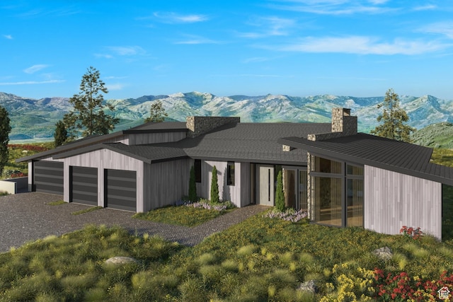 3575 E Wapiti Canyon Rd, Park City, UT 84098 - exterior space with a garage, a mountain view, and a chimney